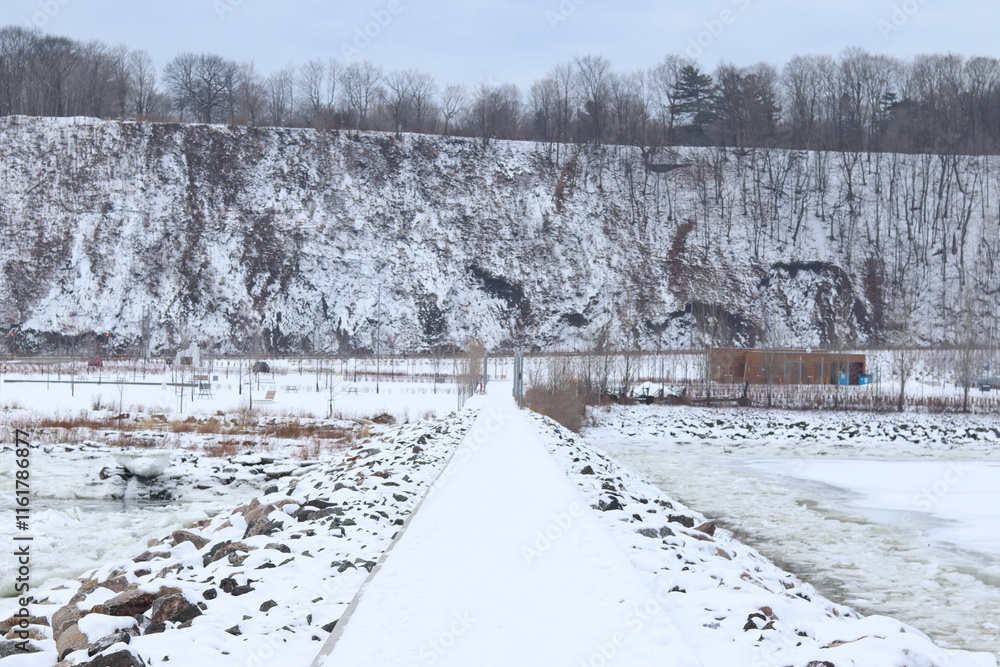 A coastline and a river with icebergs and a snowy dock. A shore and the St-Laurent river in Quebec and in winter. A cliff of a riverside in Quebec city and the Champlain boulevard. A coastline and a river with icebergs and a snowy dock. A shore and the St-Laurent river in Quebec and in winter. A cliff of a riverside in Quebec city and the Champlain boulevard.
