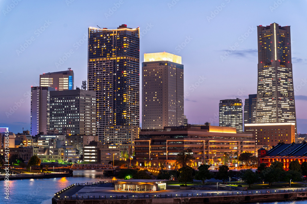 sweet sunset winter and light illumination from Cityscape of Yokohama city, Skyline and office building and downtown in Minatomirai Area, Yokohama city port, Kanagawa, Japan