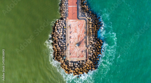 Overhead view of the Tampico pier that divides the Panuco River and the sea from the Gulf of Mexico. From this angle the difference in colors of the fresh and salt waters can be perceived. photo