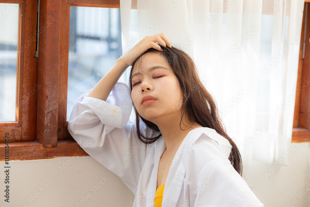 Sexy asian beautiful woman in cozy room window with white curtain woman Sexy asian beautiful woman in cozy room window with white curtain woman