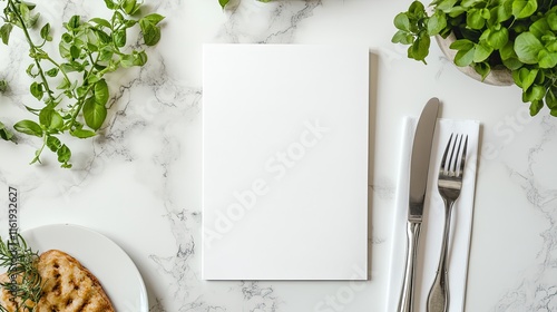 Blank menu on marble table with food & herbs. photo