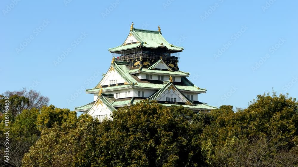 Osaka Castle under the blue sky in Japan, Travel or Japanese tradition Osaka Castle under the blue sky in Japan, Travel or Japanese tradition