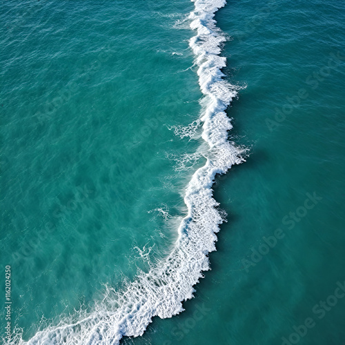 Aerial view beautiful of sea waves from drone. Stock image of blue color of ocean water, sea surface. Top view on turquoise waves, clear water surface texture.