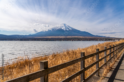 Wallpaper Mural View of mount Fuji with background clouds and wooden fence at lake Kawaguchiko in foreground Torontodigital.ca