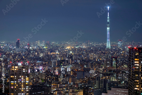 Obraz na płótnie Nightlight Cityscape of Tokyo, city aerial skyscraper view of office building and downtown and street of minato in tokyo with twilight sky background. Japan, Asia w salonie