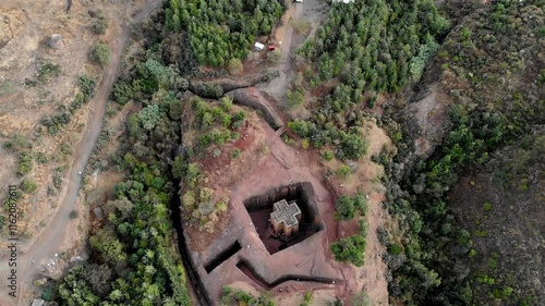 Aerial footage over Saint George Cross shaped rock hewn, Ethiopia
Drone view Saint George Cross shaped rock hewn church, Lalibela, Ethiopia 

