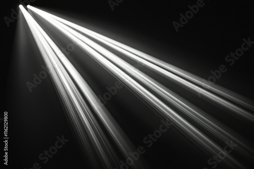 Converging beams of light radiate outwards from a central point, creating a dramatic, high-contrast effect.