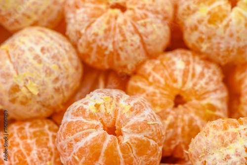 Juicy citrus delight showcases vibrant orange mandarins in a sunlit market setting photo