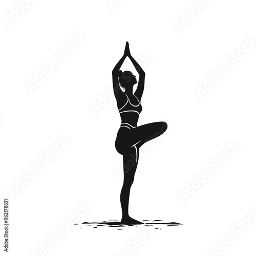 Silhouette of a woman practicing yoga in a balancing pose