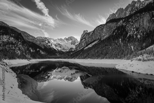 Mountain scenery in the Alps with Dachstein summit reflecting in Lake Gosausee, Salzkammergut, Austria in the Winter 