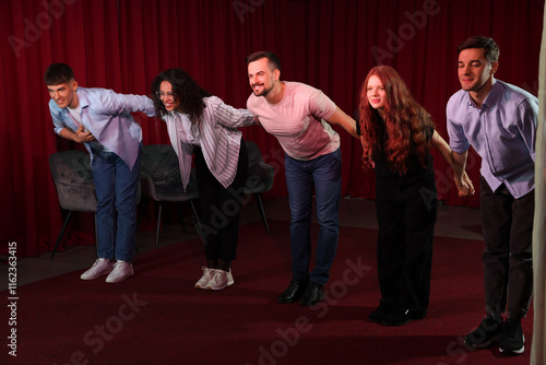 Billede på lærred Professional actors bowing on stage in theatre
