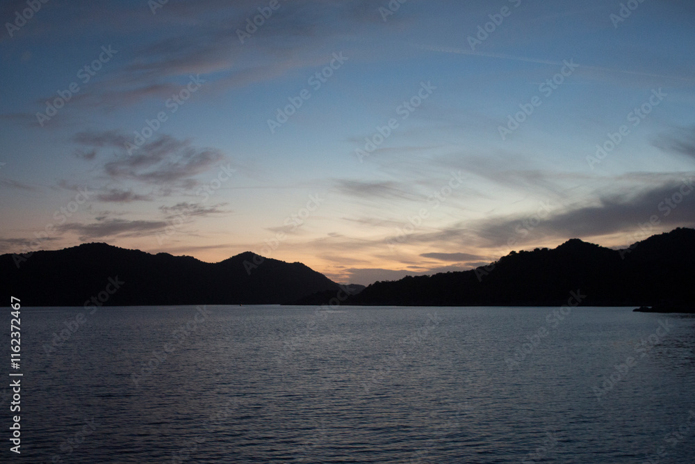 Panorama of golden hour at the Turquoise Coast Turkey with islands as black silhouette Panorama of golden hour at the Turquoise Coast Turkey with islands as black silhouette