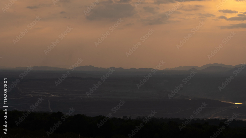 Fototapeta premium Beautiful natural scenery of a public park, sunset view with mountain ranges at Mae Moh mine, Lampang Thailand.