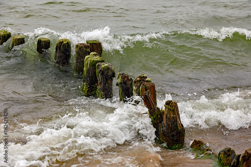 Worn breakwaters on the Baltic Sea coast, Ustronie Morskie, West Pomerania, Poland photo