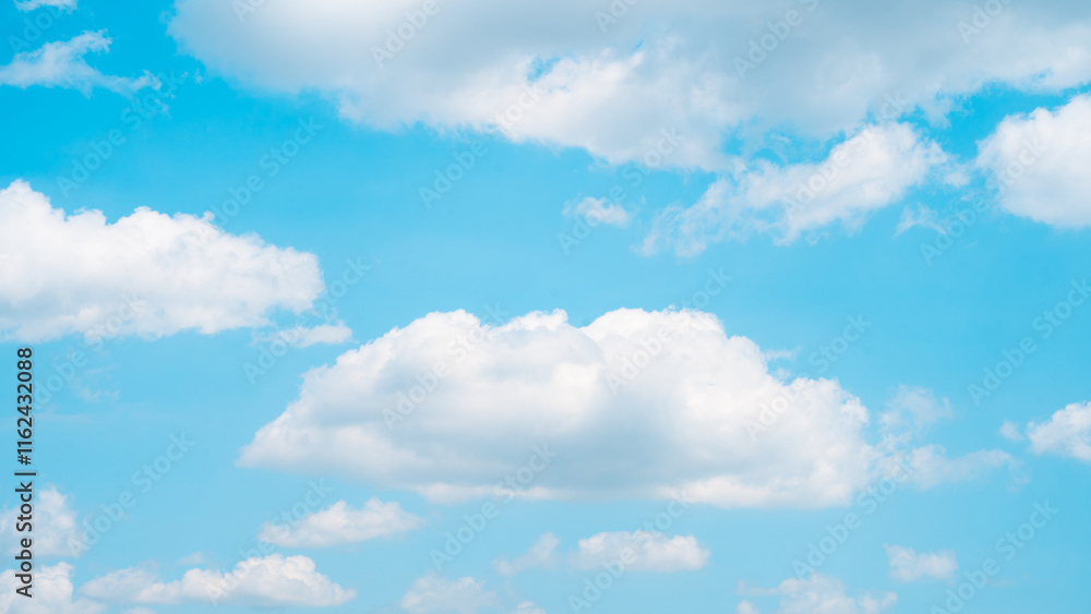 Fluffy white clouds floating in a crisp blue sky, creating a serene and refreshing visual for weather and outdoor themes Fluffy white clouds floating in a crisp blue sky, creating a serene and refreshing visual for weather and outdoor themes