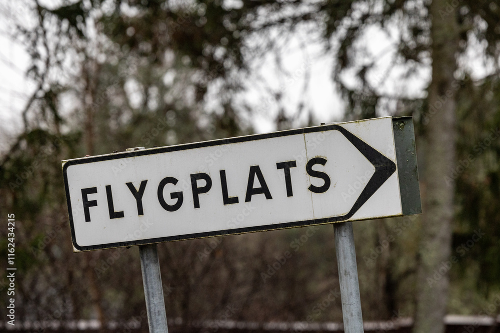 Stockholm, Sweden A small sign on a country road says in Swedish: Airport. Stockholm, Sweden A small sign on a country road says in Swedish: Airport.
