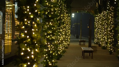 A decorated train platform in a Christmas spirit