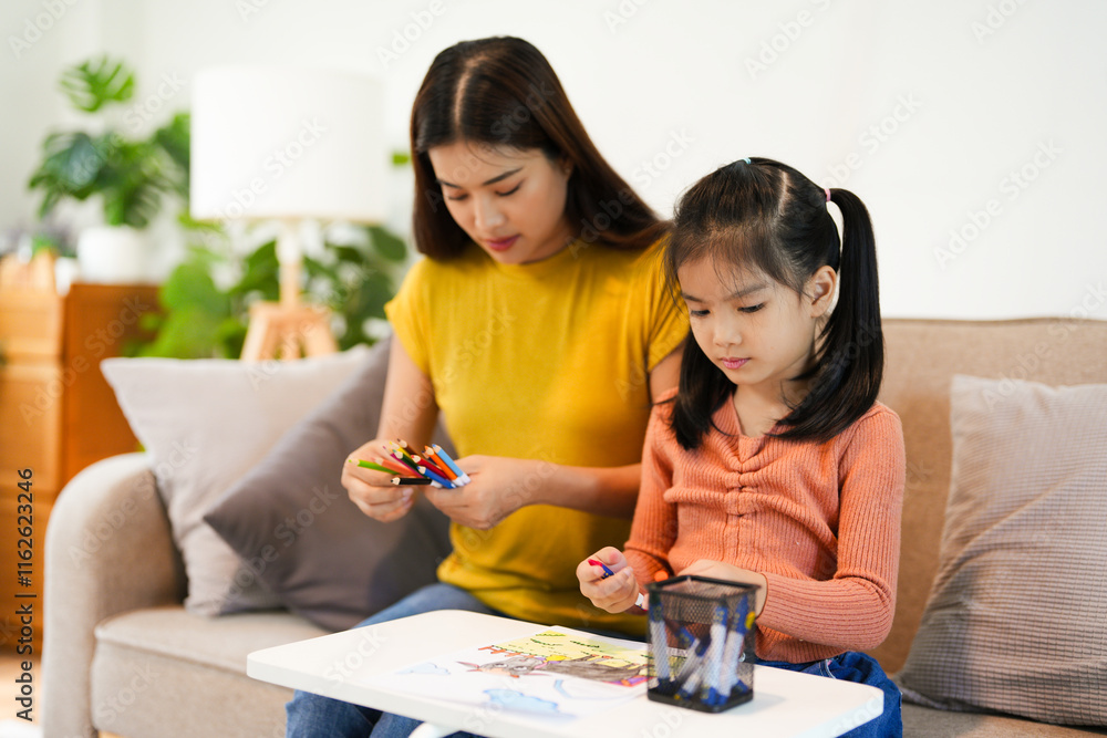 modern mother joining homework together with daughter, happy time in living home and comfortable feel free modern mother joining homework together with daughter, happy time in living home and comfortable feel free
