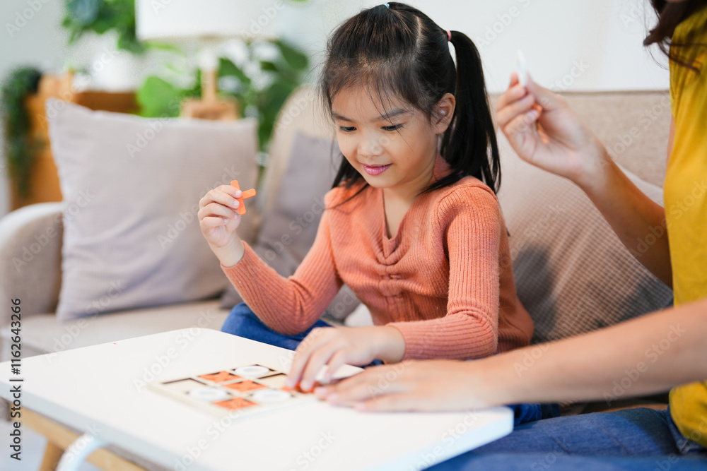 Happy family playing board game at home, happiness concept Happy family playing board game at home, happiness concept