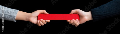 Two hands are holding a bright red object, symbolizing connection, teamwork, or shared effort against a black background.