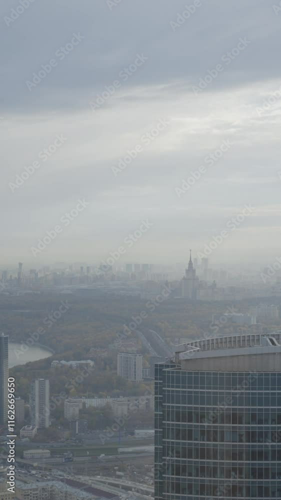 An Urban Landscape Featuring Overcast Skies Alongside Modern City Buildings and Structures. Action An Urban Landscape Featuring Overcast Skies Alongside Modern City Buildings and Structures. Action