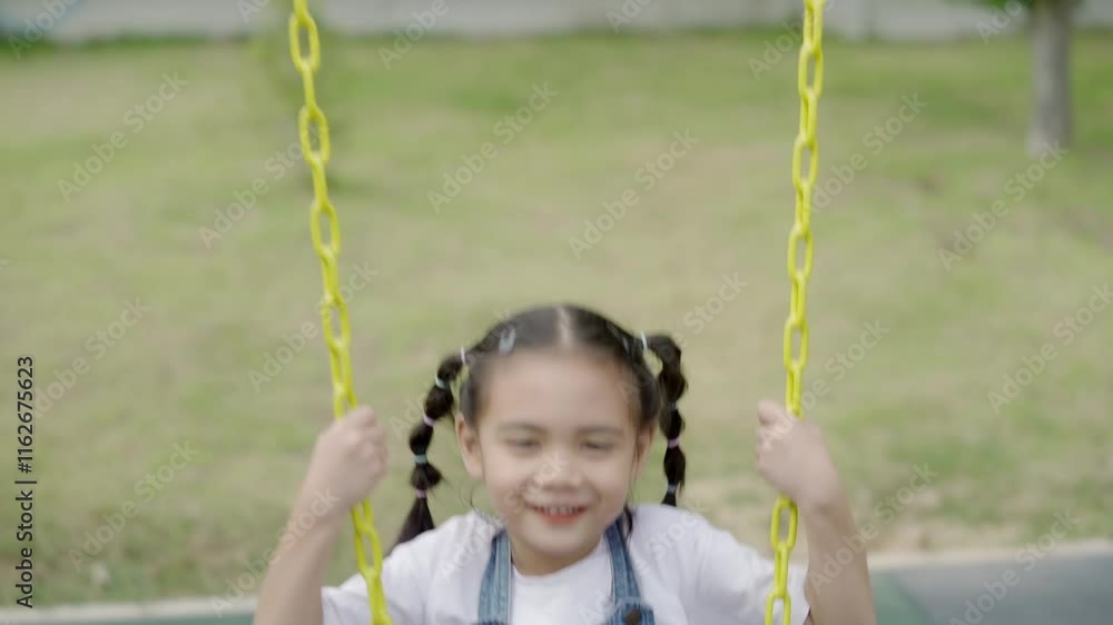 Girl in colorful playground in park on summer vacation Girl in colorful playground in park on summer vacation