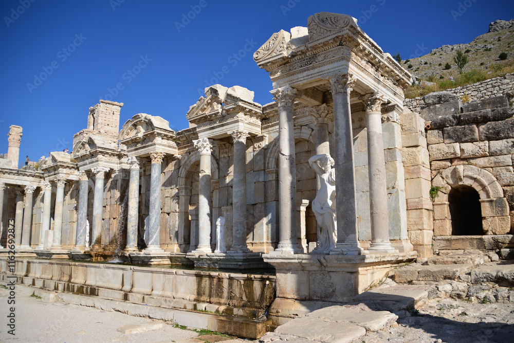 Fototapeta premium a part of an ancient theatre with columns and statues Sagalassos Turkey