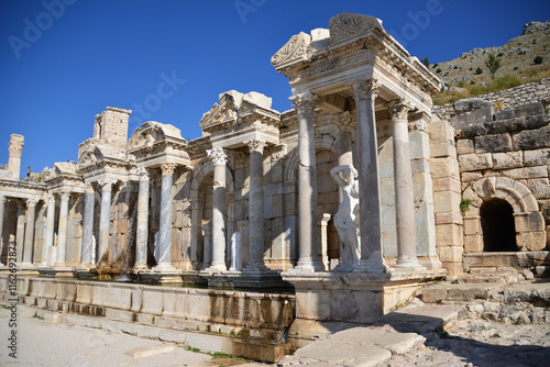 a part of an ancient theatre with columns and statues Sagalassos Turkey photo