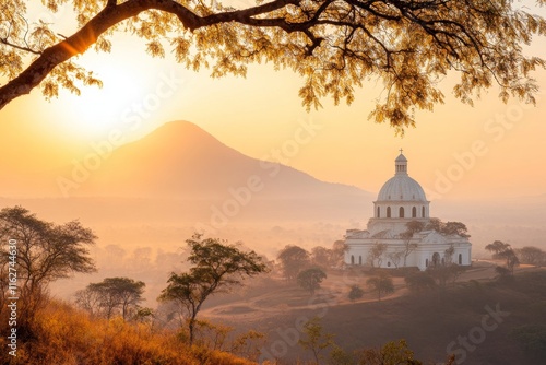 A scenic view of the Basilica of Our Lady of Peace in Yamoussoukro, with its grand dome reflecting the sunlight