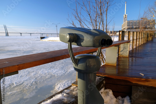 Quadro su tela outdoor binoculars close-up against winter landscape