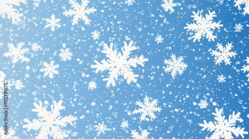 Snowflakes falling from a clear blue sky, ideal for winter or seasonal concepts photo