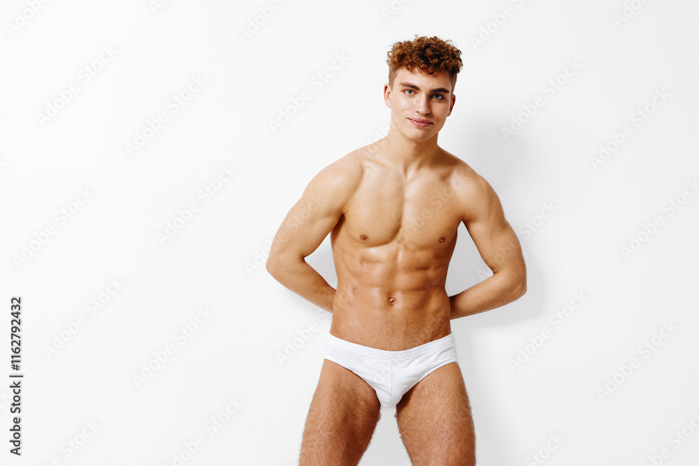 Fototapeta premium An Athletic Male Model is Posing in Stylish and Trendy Swimwear that Looks Incredible