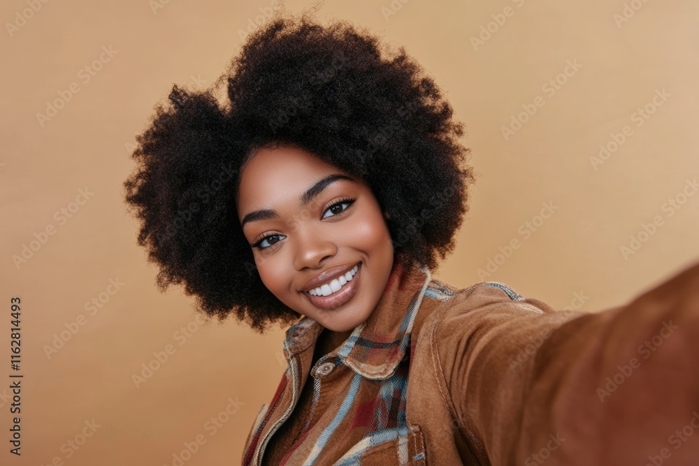 African American woman with curly hair taking a selfie, perfect for social media or personal use African American woman with curly hair taking a selfie, perfect for social media or personal use