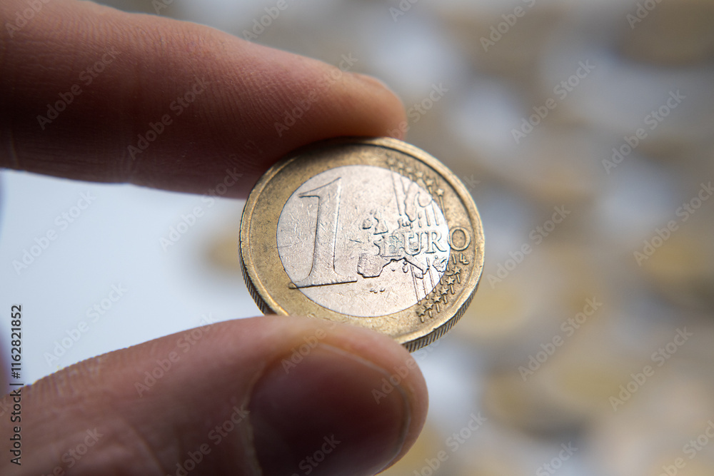 European money, one euro coin. Business and saving.