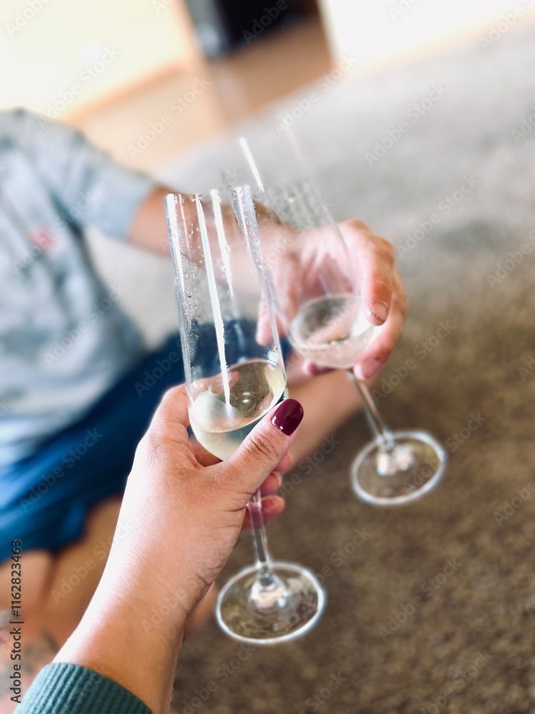 Obraz premium Cheers champagne toast to new homeownership