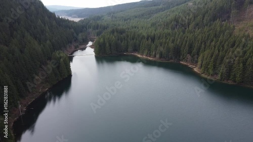 Wallpaper Mural Peaceful moments above a quiet lake and green mountains on a cloudy day Torontodigital.ca