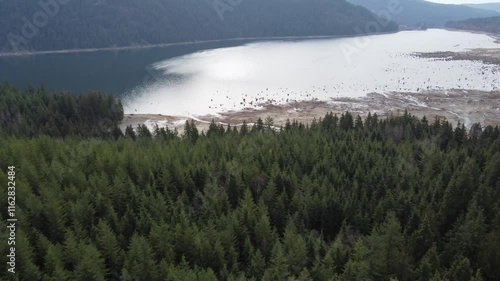 Wallpaper Mural Capturing the calm of a cloudy day over a scenic lake and green hills Torontodigital.ca