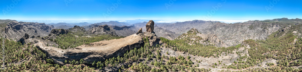 Aerial view of Roque Nublo, Gran Canaria. Large volcanic formation in Gran Canaria. Spain.
In the background the island of Tenerife with Teide the volcano. Aerial view of Roque Nublo, Gran Canaria. Large volcanic formation in Gran Canaria. Spain.
In the background the island of Tenerife with Teide the volcano.