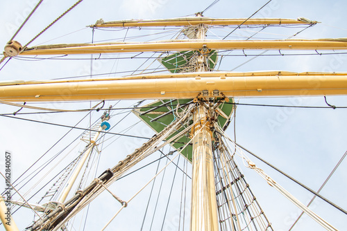 Looking up at a ship's mast supports and rigging, showcasing maritime craftsmanship. photo