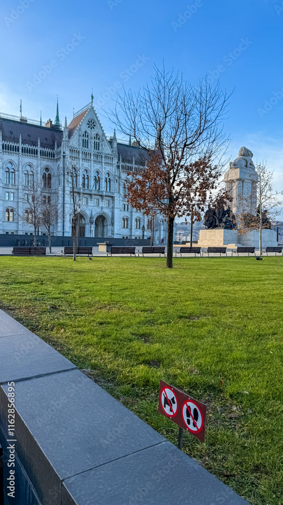 Fototapeta premium The historic Gothic architecture of the Hungarian Parliament Building in Budapest, captured on a bright winter day, evokes concepts of political history and European heritage