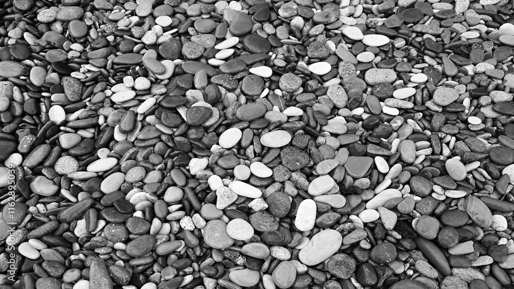 abstract black and white background with many round pebble stones abstract black and white background with many round pebble stones