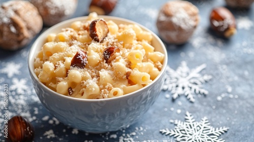 Macaroni and cheese served with roasted chestnuts, isolated on a winter-themed surface with snowflake decorations photo