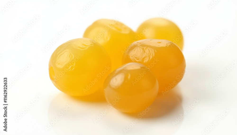 Close-up of vibrant yellow food spheres Close-up of vibrant yellow food spheres