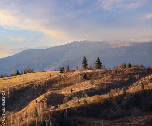 Last good weather days in autumn mountain countryside. Peaceful picturesque Ukrainian Carpathians mountains scene. photo