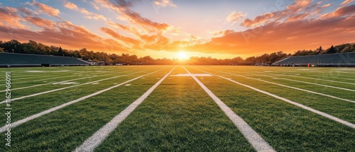A football field with a sunset in the background