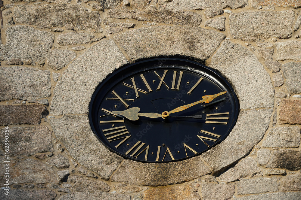 Antique clock with black dial and gold numerals. Antique clock with black dial and gold numerals.