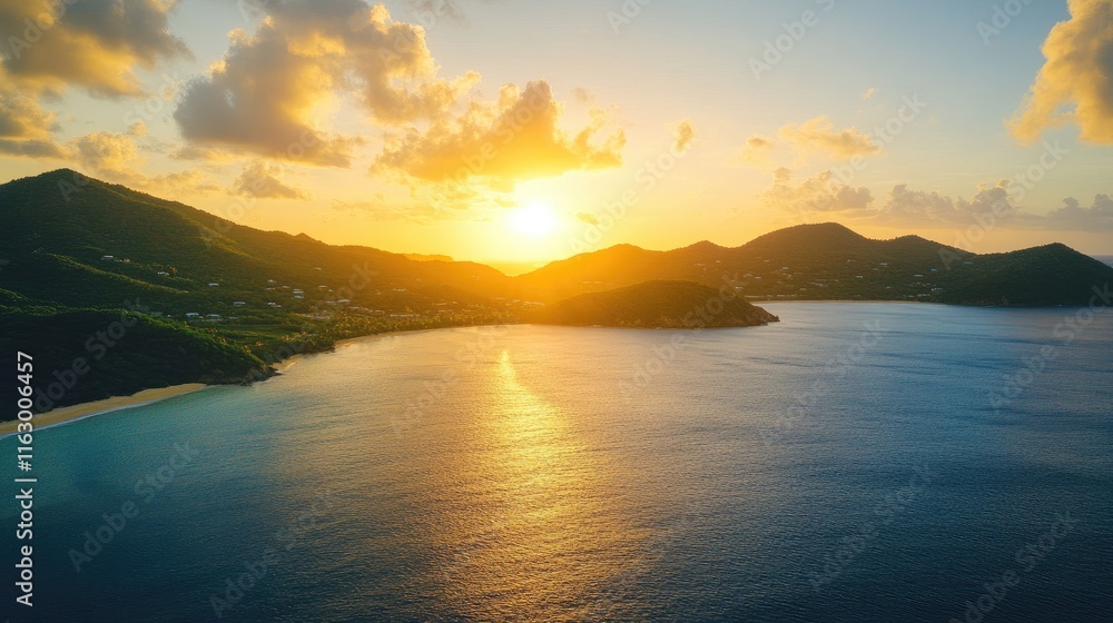 Fototapeta premium Caribbean coastline at sunset with aerial view of turquoise ocean sandy shore and mountains in serene golden light atmosphere