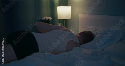 Male falling down on bed and asleep after overloaded hard work. chronic fatigue and employee overtime