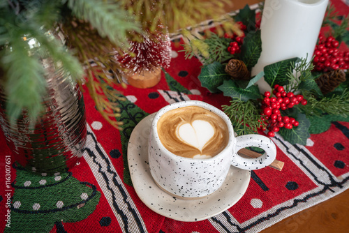 Close up of Hot coffee latte with latte art milk foam in cup mug with Xmas decors and Xmas tree baubles on wood desk Celebrating Merry Christmas and New year,Merry x-mas