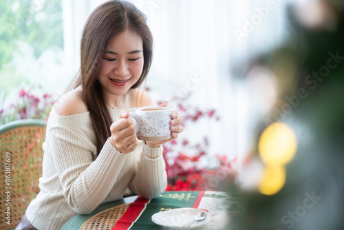 Obraz na płótnie Portrait beautiful asian woman holding of positive the having cup of coffee,milk or chocolate at home in the living room indoors Decoration During Christmas x-mas and New Year holidays. w salonie